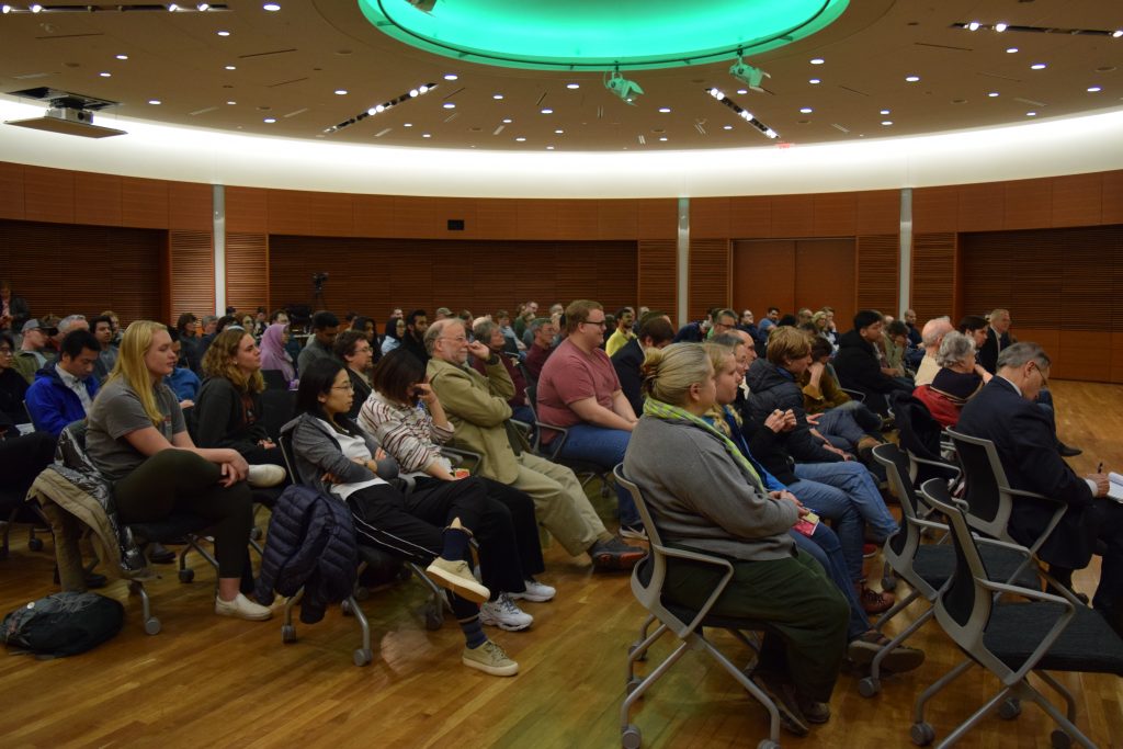 Audience attending socialism, social democracy and capitalism debate event.