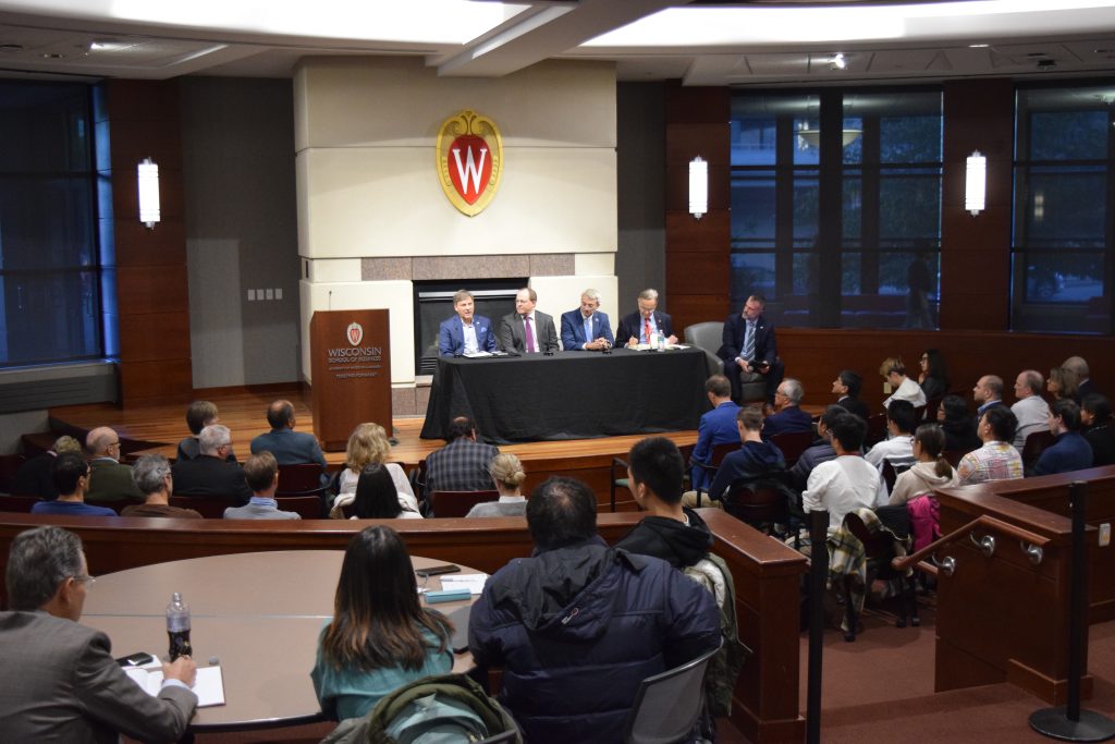 panelists and moderator Kim Ruhl with an audience